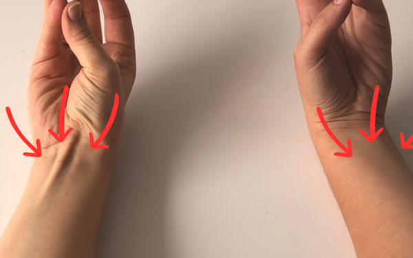 A tendon raises up when you touch your pinky to your thumb