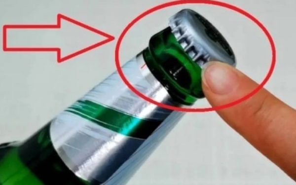 The bottle cap has a small, easy-to-find dot