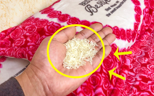 Why do many people place a handful of rice under their pillow?